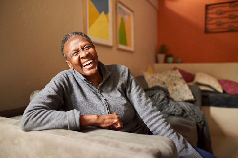 laughing senior woman at home